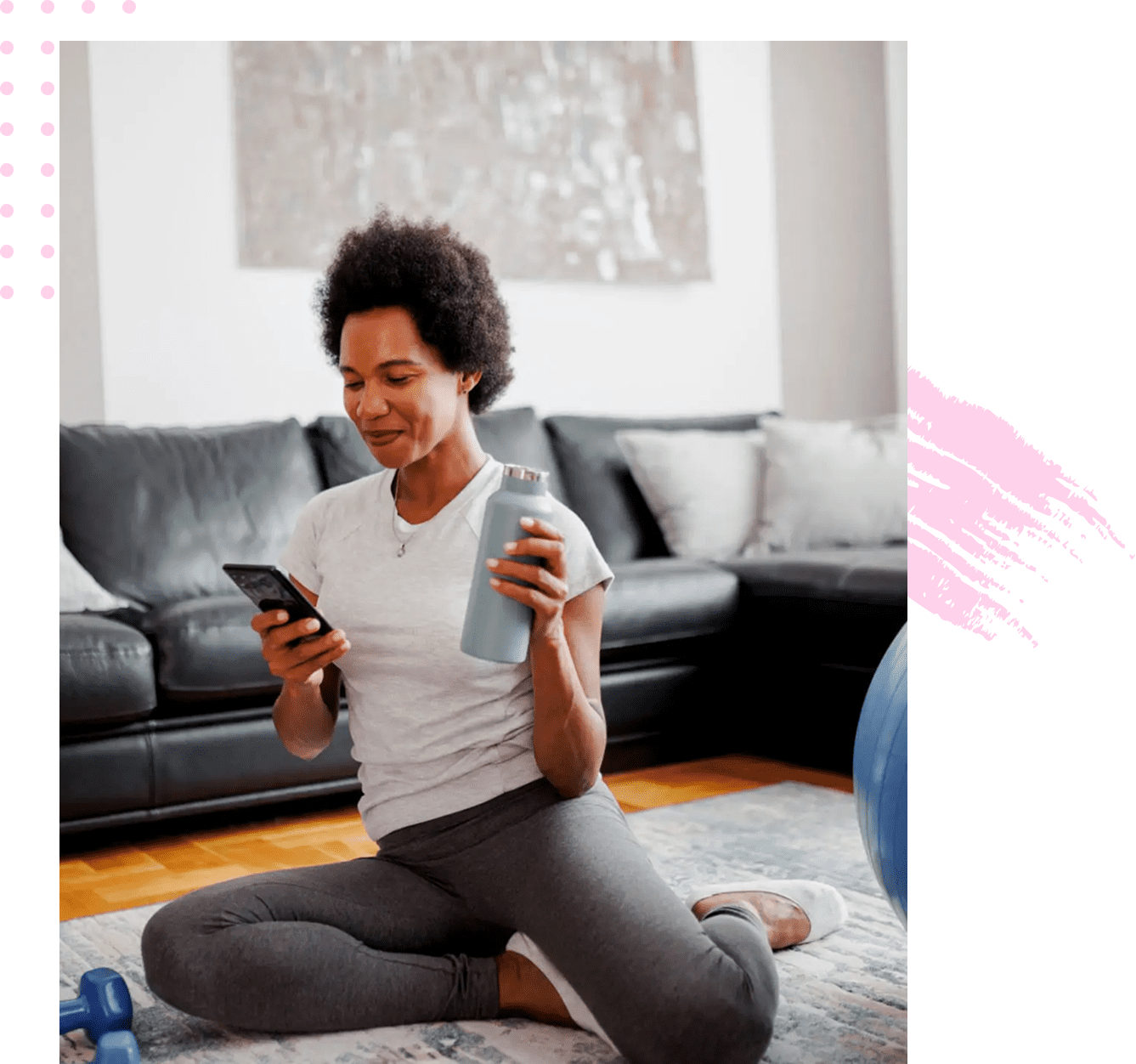 Woman holding water bottle checking phone