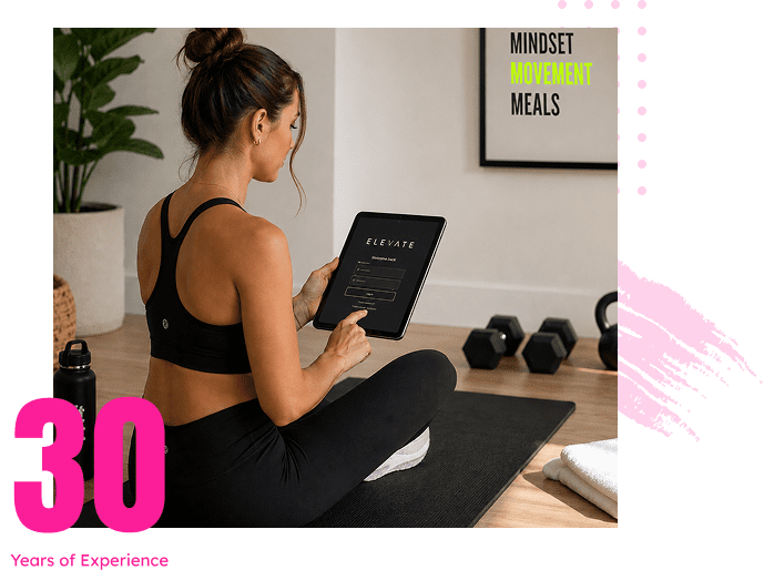 Woman on yoga mat using tablet workout app