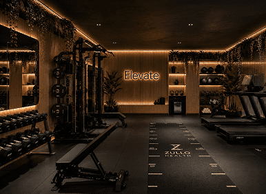 Dimly lit upscale gym interior with Elevate sign